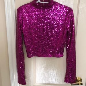 Hot pink long sleeve zip up sequined crop top.